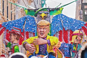 Allegorical car with Donald Trump doll during performing Grand show Mardi Gras parade