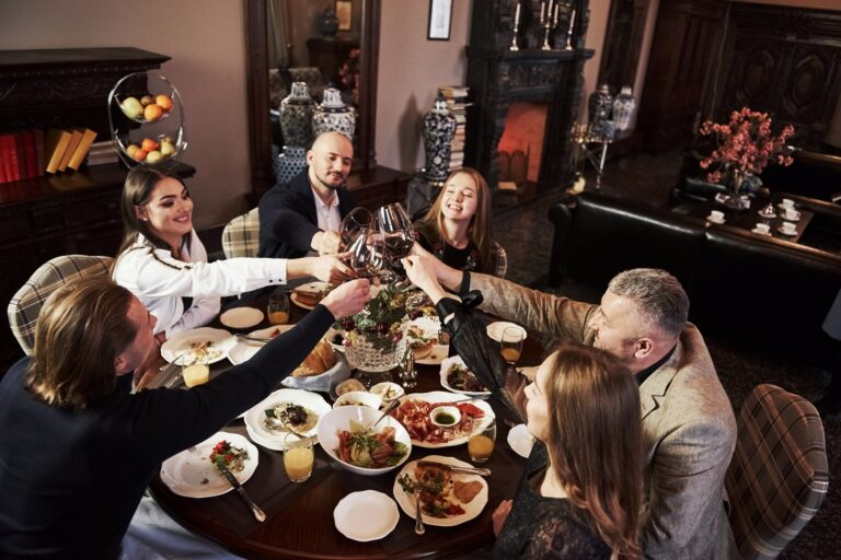 ¿Nuevos Ricos En Cuba? Rich people. Family friends having nice time in beautiful luxury modern restaurant