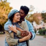 Young couple in love in the city during autumn day.