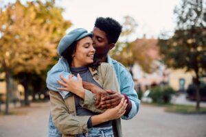 Young couple in love in the city during autumn day.